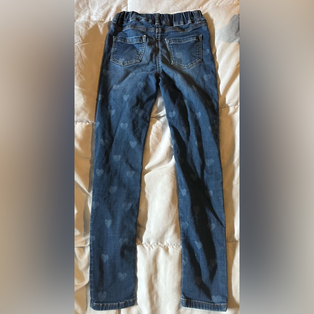 Stylish girls skinny jeans with heart patterns